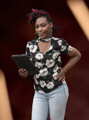 Stylish African American Woman with Colorful Braids Holding Smartphone in Floral Top