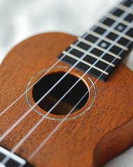 Close-up of a ukulele's soundhole and fretboard