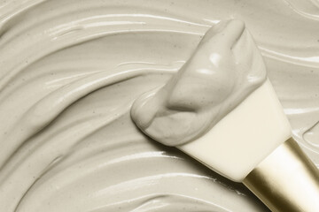 Clay mask with a spatula. Cremy cosmetic mud texture. Skincare product application