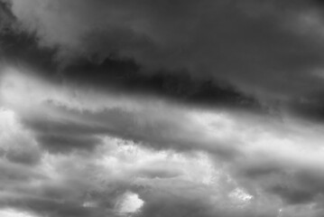 Dark stormy sky with thick ominous clouds and dramatic lighting creating a moody atmosphere...