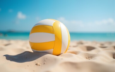 Obraz premium Beach volleyball ball on the sand beach. Team sport concept. High quality