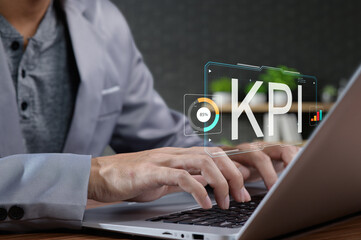 Business Professional Analyzing Key Performance Indicators on Laptop