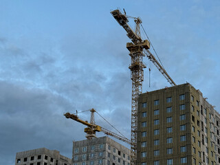 Crane and building construction. construction site. Multi Storey Residential Buildings...