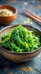 Fresh wakame seaweed salad with sesame seeds and sliced green onions in a delicate bowl