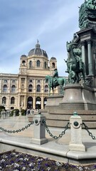 Fototapeta premium Grand facade and bronze equestrian statues frame Vienna’s Kunsthistorisches Museum entrance