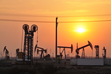 Drilling rig at sunset