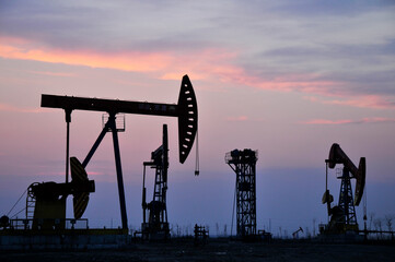 Drilling rig at sunset