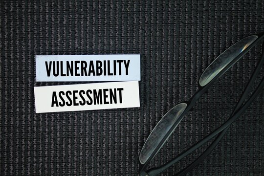 colored paper with the word vulnerability assessment. technology concept. safety management concept.