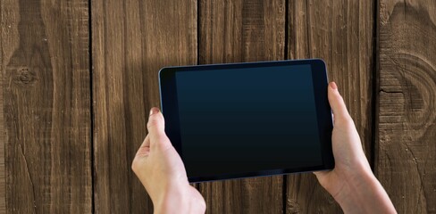 Cropped of hand touching digital tablet