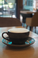 Enjoying a warm cup of coffee in a cozy cafe