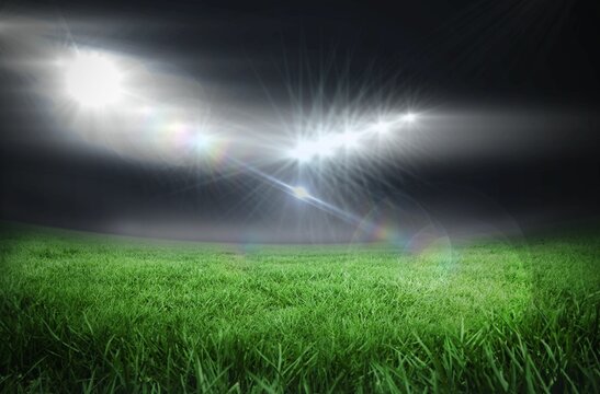 Fototapeta Football pitch under bright lights