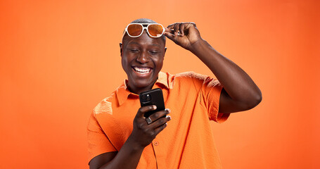 Excited, fashion or black man with phone in studio for surprise discount, sale or bargain deal....