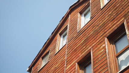 Wooden house exterior under clear blue sky
