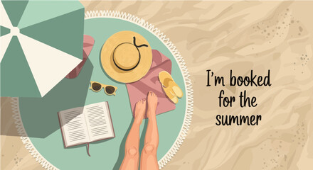 Top view of woman relaxing on beach reading in summer