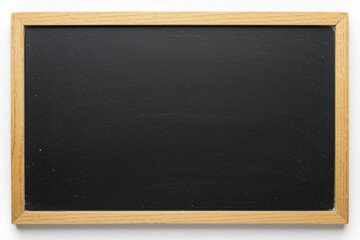 Fototapeta premium A blank black chalkboard with a wooden frame, ready for writing or drawing.