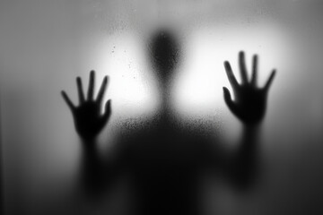 Abstract image of a blurred figure behind a translucent screen. Evokes emotion, mystery, isolation, and psychological depth. Artistic concept with soft light and minimalism.