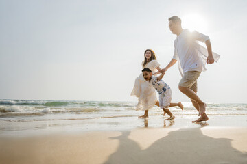Family holiday vacation beach. Asian happy family outdoors summer travel. Fun families outdoors. Family vacation beach.