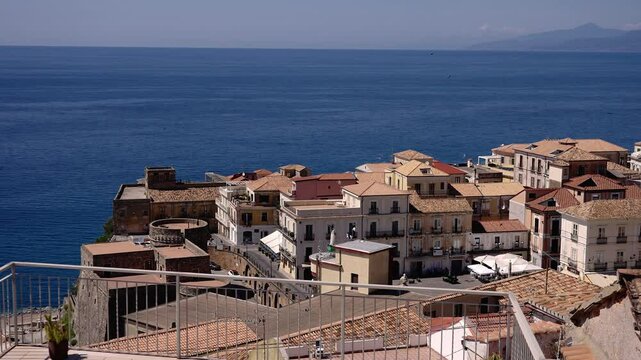 Picturesque cityscape of Pizzo Calabro with its Murat Castle and colorful buildings perched on a cliff overlooking the Tyrrhenian Sea, a popular tourist destination in Calabria, Southern Italy