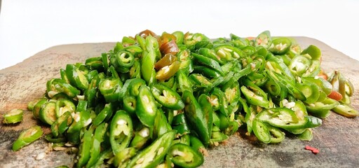 Close up landscape photo of a pile of thinly sliced green chilies