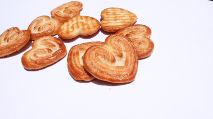 Tasty Heart shaped sweet biscuits with caramel design. Little hearts brand biscuits