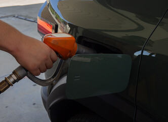 Refueling a Car at Gas Station