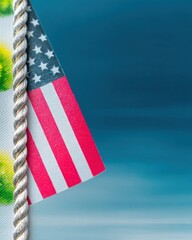 Closeup of American Flag with Rope Against a Blue Sky