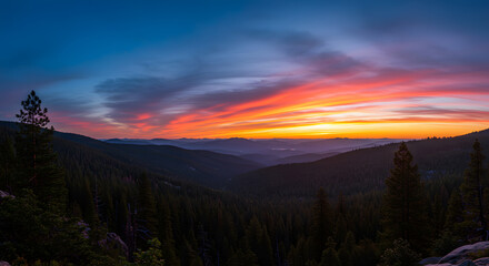 Vibrant Sunset Over Forested Mountains