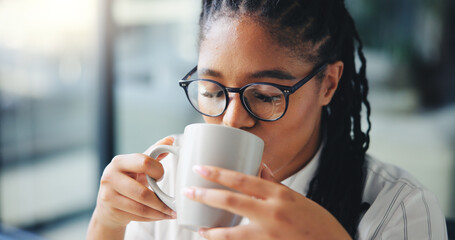 Black woman, coffee or glasses with drink at office for morning beverage or fresh start. Female person, journalist or copywriter with cup or mug of caffeine for energy or productive day at workplace