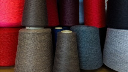Multicolored Yarn Cones for Textile Production. Assorted Yarn Cones in Various Shades and Textures.
