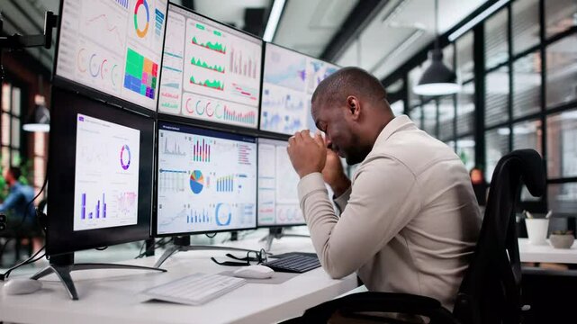 Overwhelmed Business Owner Looking At Stressful Data
