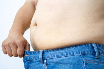 Naklejka premium Obesity man body, fat male belly,close up on white background.highlighting issues of obesity or body weight.
