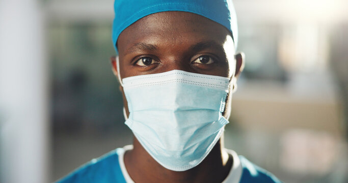Portrait, doctor and black man with mask for surgery, medical career or wellness in hospital. Clinic, face or confident surgeon with scrubs or confidence for healthcare services, medicine or help
