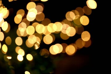 golden christmas lights,Picture of blurred lights at street,Golden blur and double bokeh of lights from focus