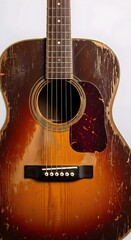 unbranded old vintage worn distressed wooden acoustic guitar isolated against a white background.  antique guitar, isolated guitar, classic guitar, white background, guitar on white, aged guitar
