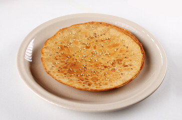 Indian Gujrathi snacks called Khakhra serve in plate isolated on white background 