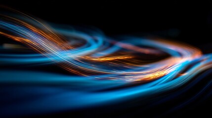 Abstract luminous streaks of blue and gold dance across a dark backdrop with surreal motion blur.