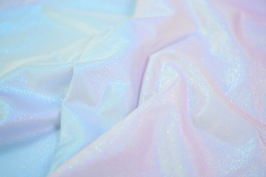 Pastel iridescent fabric texture background
