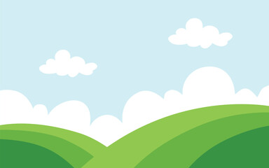 Green field and blue sky with clouds