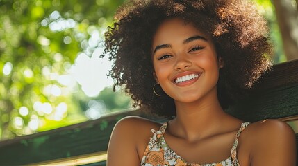 A joyful young woman smiles outdoors