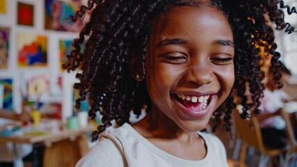 A joyful child painting in a bright art class, captured in a close-up angle. The video style is vibrant and lively, showcasing creativity and fun. - Powered by Adobe