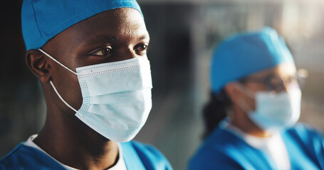 Thinking, doctor and man with mask for surgery, medical career or wellness in hospital. Clinic,...