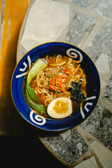 Ramen is a Japanese noodle soup dish originating from China, made from wheat noodles served in a variety of broths and topped with various toppings.