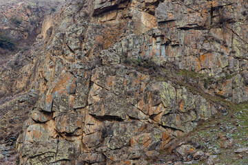 Rugged sedimentary cliff, full-frame background