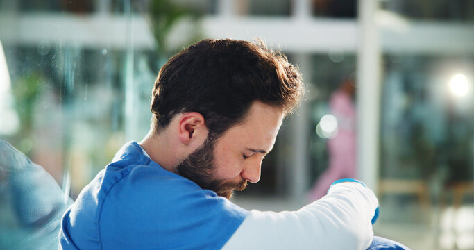 Sad, man and doctor on floor at hospital for medical mistake, surgery fail and patient loss. Upset, male surgeon and stress from bad news, wrong diagnosis and operation error of healthcare burnout