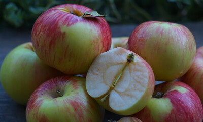 A pile of apples on a board in nature