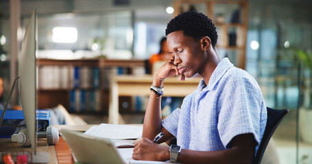 Tired, laptop and man at university in library for learning, education and studying at college....