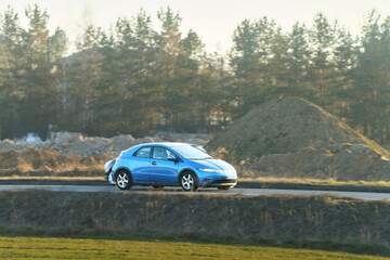 Electric car on empty country road