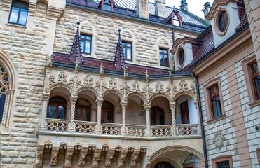 Fragment of traditional architecture of the 18th century. Balcony with stucco in Moszna Castle in Poland