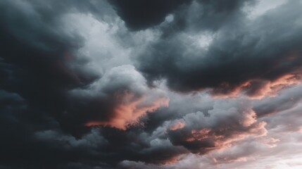 Obraz premium Moody storm clouds tinted with fiery twilight hues evoke atmospheric tension, perfect for creative compositions or Tempest Day musings