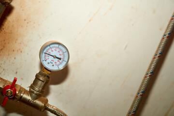 Hot water temperature,pressure sensor in basement plumbing system on white